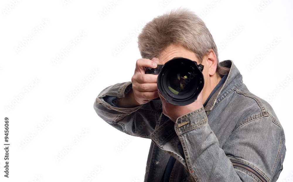 one photographer with photocamea over white background one photographer with photocamea over white background