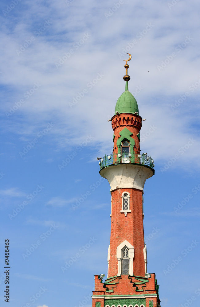 Mosque minaret on a blue sky background