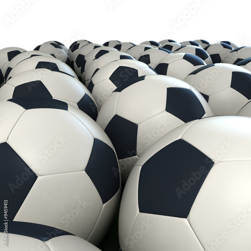 Arrangement of soccer balls against a white background
