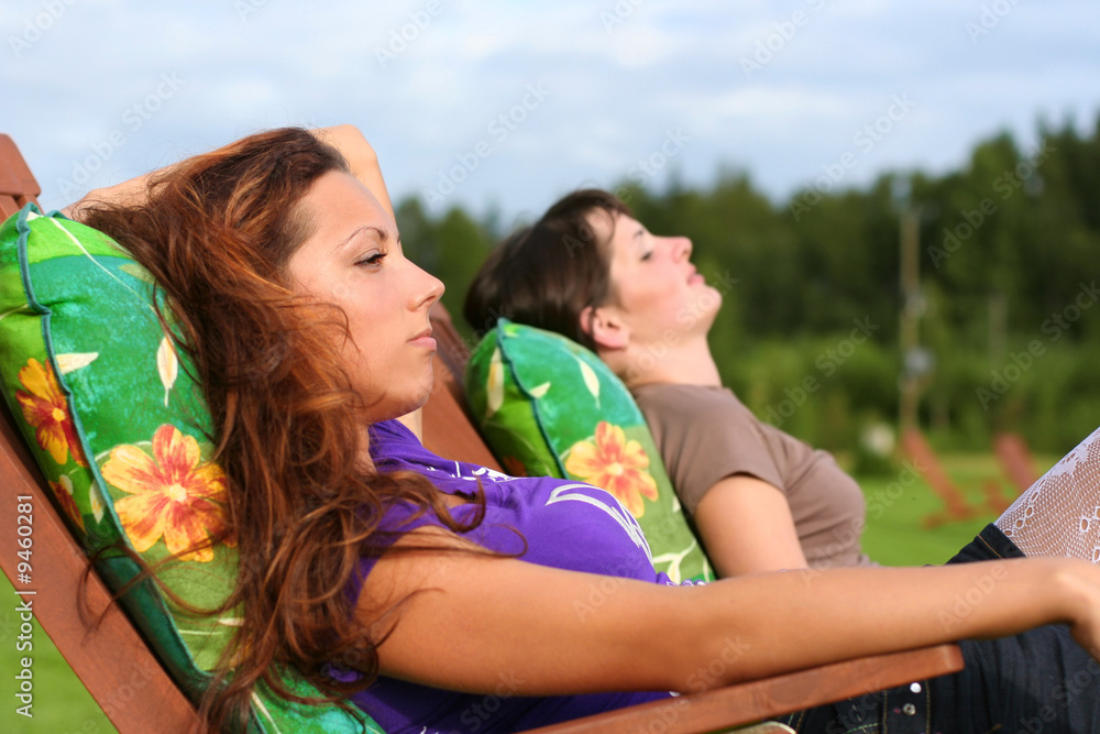 Fototapeta premium two young girls relaxing outdoors