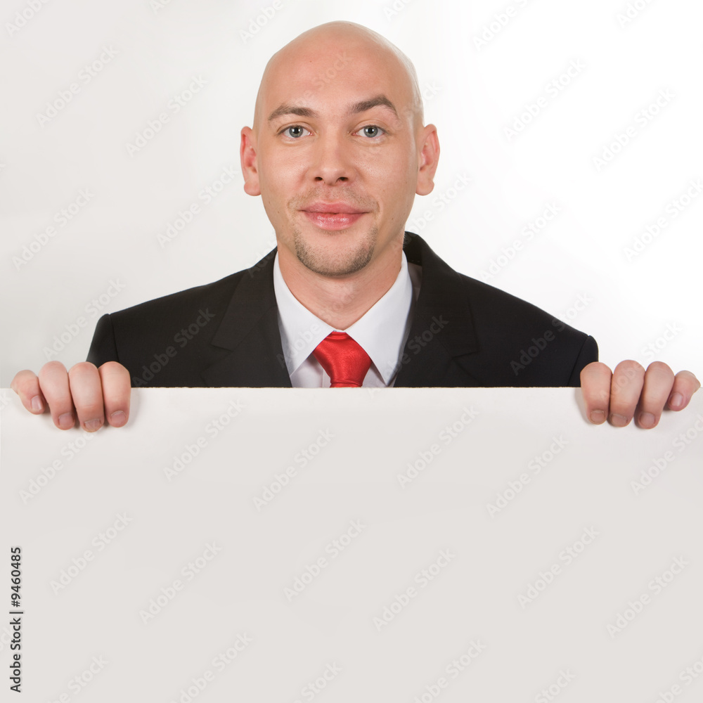 Photo of smiling male behind partition looking at camera Photo of smiling male behind partition looking at camera