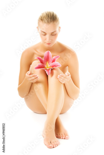 Beautiful young woman with pink lily flower