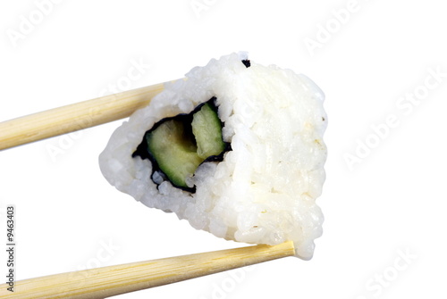 Three-cornered sushi with cucumber on the white