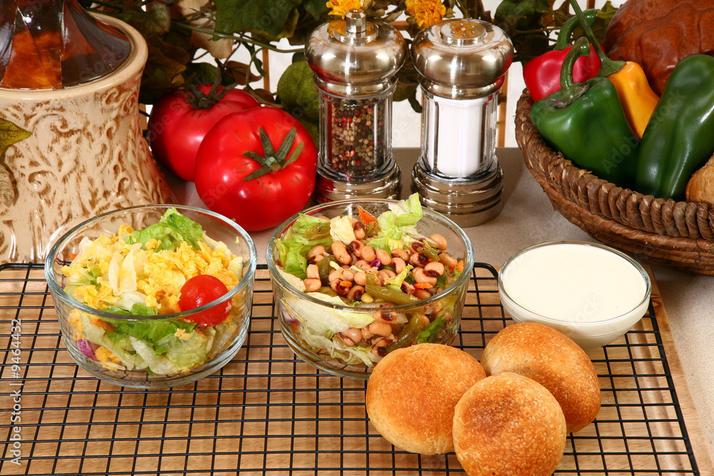 Black Eye Pea Salad, Garden Salad, and Rolls.