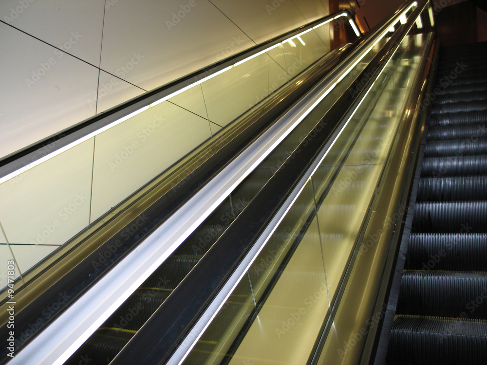Obraz premium a black escalator in a modern building