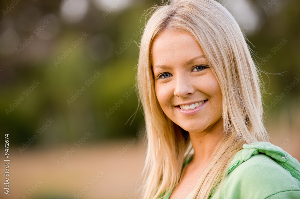 A pretty young woman outside in the garden A pretty young woman outside in the garden