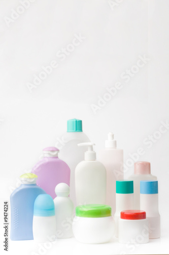 group of different plastic containers on white background