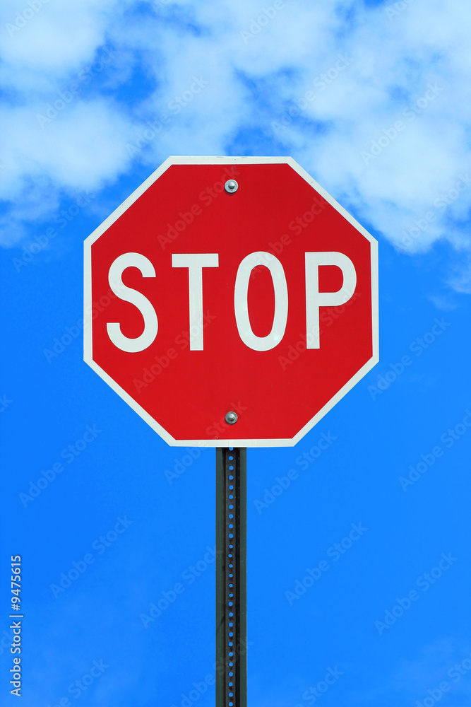 A Stop sign on blue sky backgound
