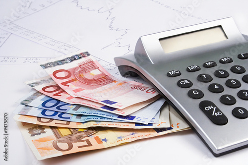 Business accessories euro money , calculator and diagrams