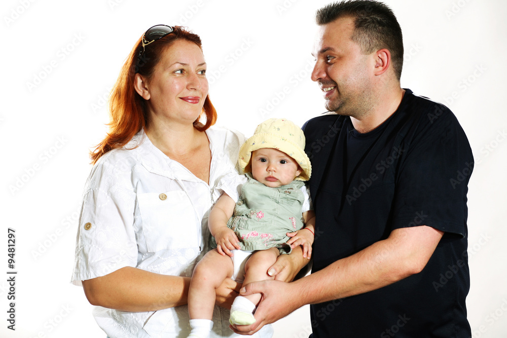 Family portrait in studio. Parents with a child. Family portrait in studio. Parents with a child.