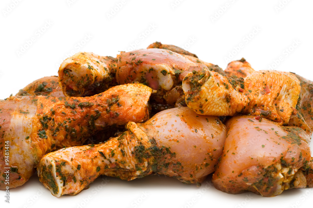 Raw chicken drumsticks on white background Raw chicken drumsticks on white background