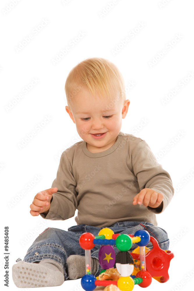 little boy play with toys. isolated on a white background little boy play with toys. isolated on a white background