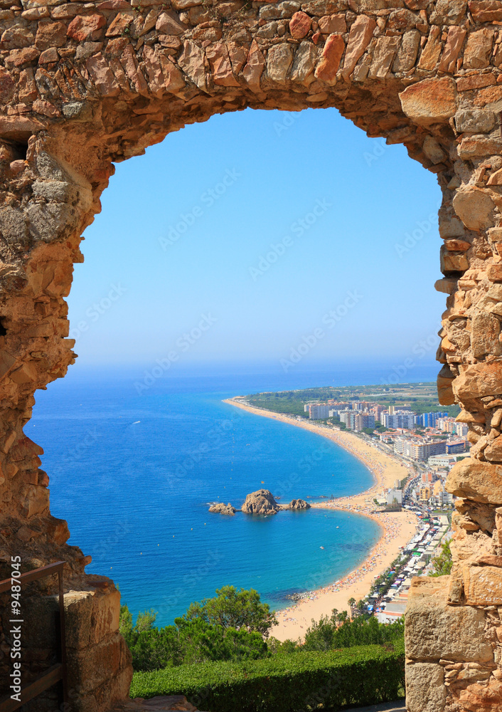 Blanes beach view through an arch  (Costa Brava, Spain)