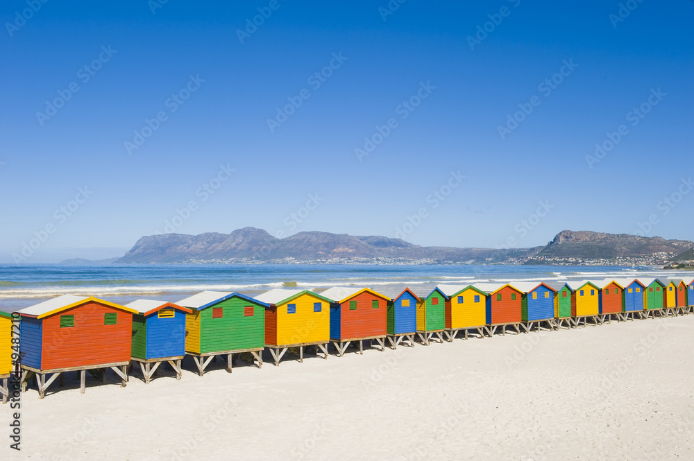 Brightly colored dressing huts on Muizenberg beach.