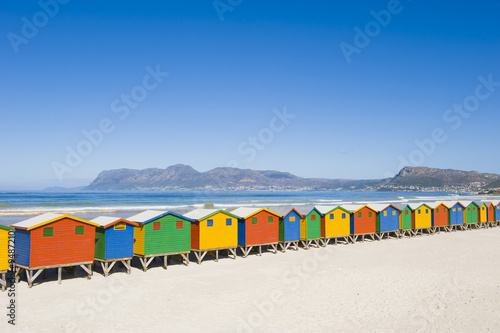 Brightly colored dressing huts on Muizenberg beach.