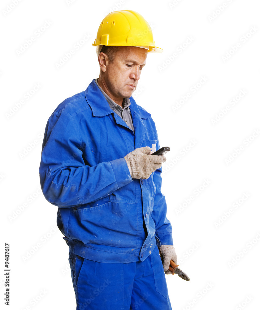 worker reading message in his mobile phone. isolated on white