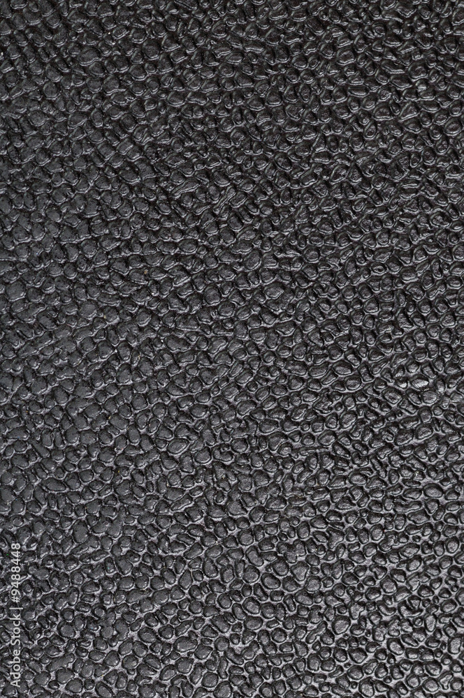 Black plastic from office chair. Texture. Dusty and dirty. Stock Adobe Stock