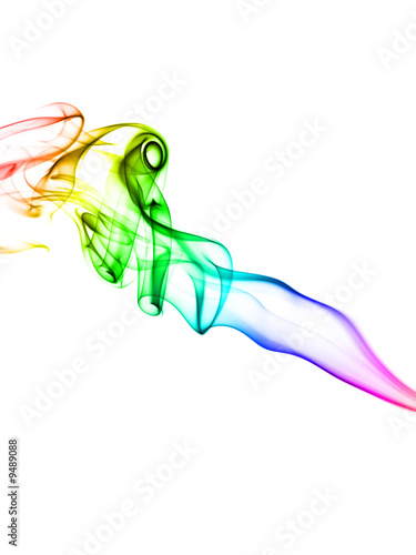 Vivid multicolored smoke forming waves on white background