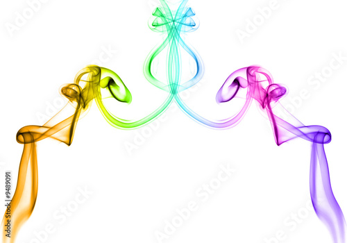 Vivid multicolored smoke forming twirls on white background