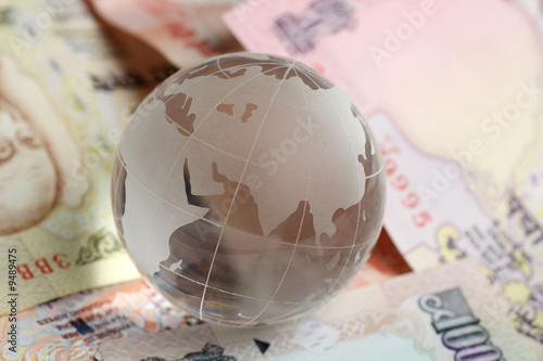 globe kept on indian rupees