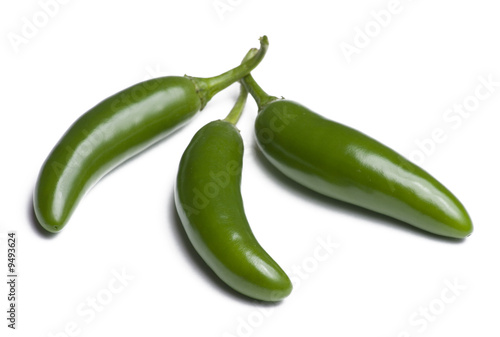 Three serrano peppers isolated on white background