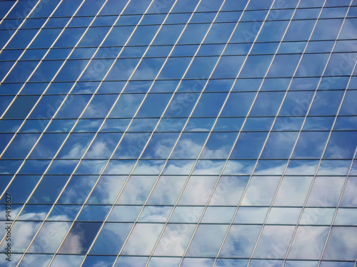 Modern building with cloud reflection.