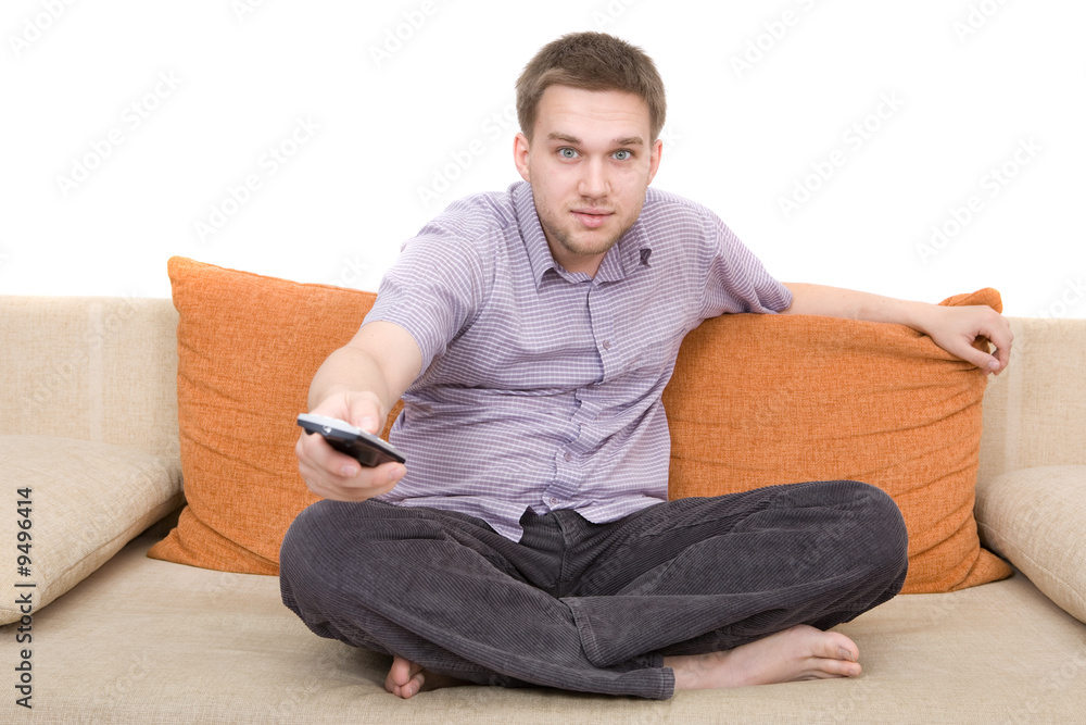 casual man sitting on sofa with remote control