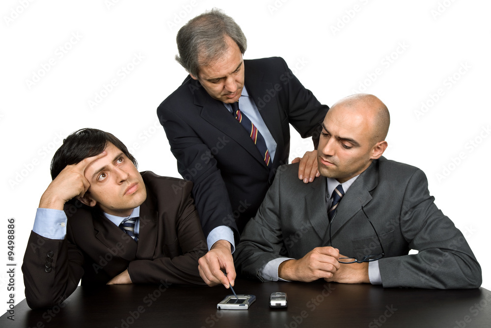 group of workers on a desk, isolated on white group of workers on a desk, isolated on white