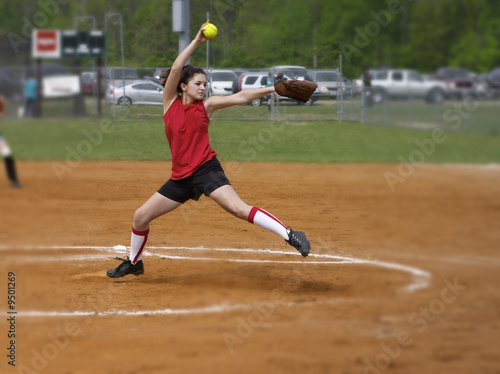 a fastpitch softball player pitching the windmill