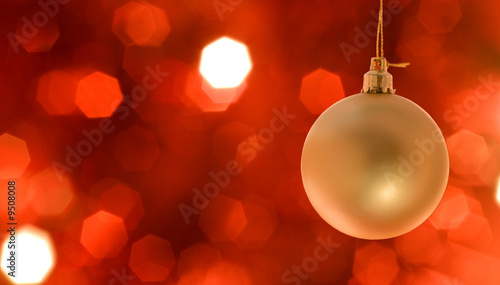 Bilde på lerret Golden Christmas ornament hanging, with copy space to the left.