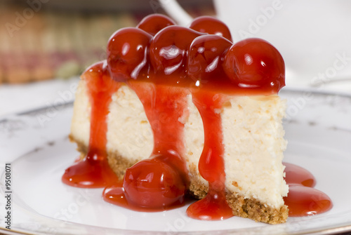 A delicious slice of cheesecake with fruit topping.