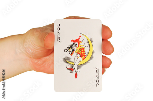 a womanish hand holds a playing cards