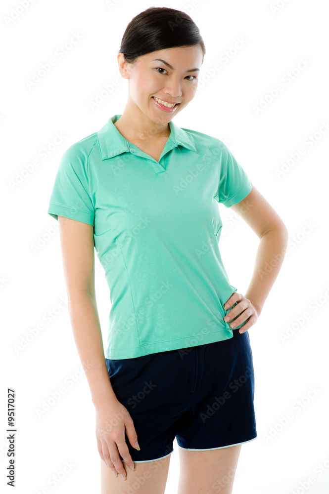 A young attractive Asian woman in green sports top