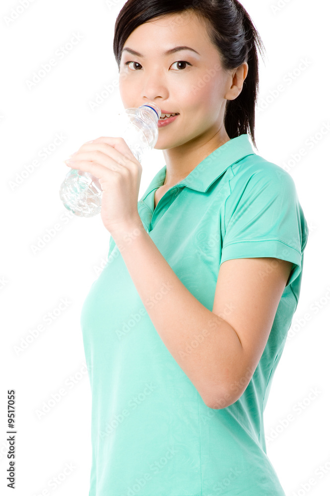 A young attractive Asian woman in sportswear with water A young attractive Asian woman in sportswear with water