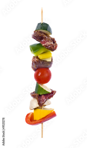 A fresh skewer of kabobs ready to grill
