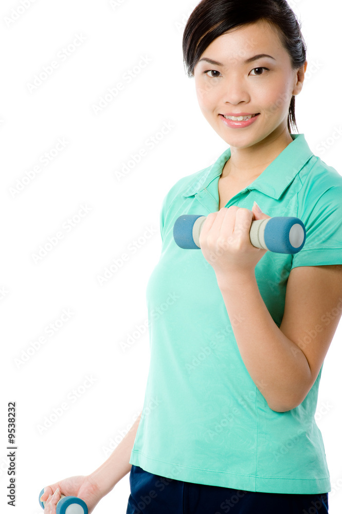 A young attractive Asian woman in sportswear with dumbbells A young attractive Asian woman in sportswear with dumbbells