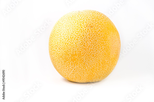 Ripe yellow melon with grid on a white background