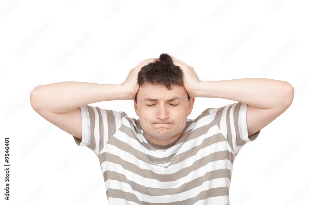 young man holding his head with both hands young man holding his head with both hands