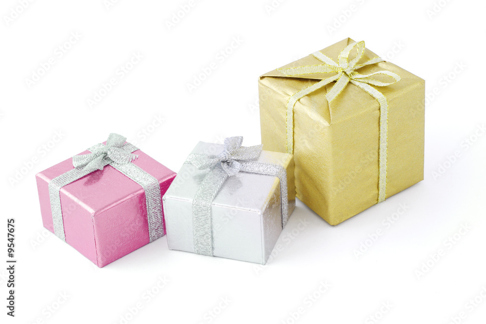 Fototapeta premium Three gift boxes decorated with bow ribbons