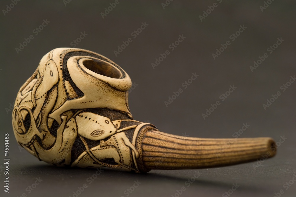 Wood engraving. Tobacco pipe on a black background. Wood engraving. Tobacco pipe on a black background.