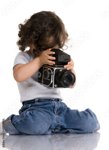 child with old SLR camera