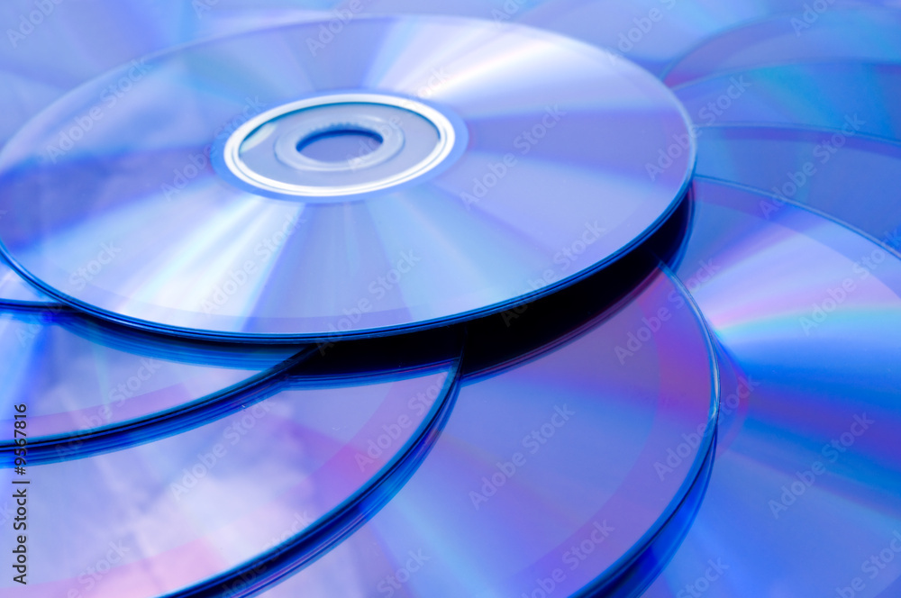 background of some colorful compact discs background of some colorful compact discs