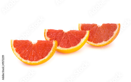 Sliced grapefruit over white background