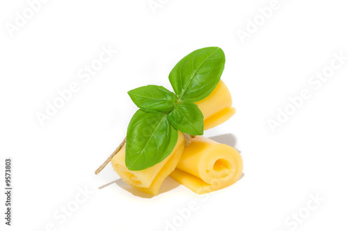 yellow cheese roll with green basil leaves