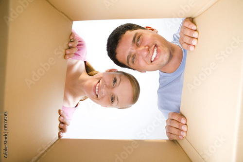 Couple lookin into box
