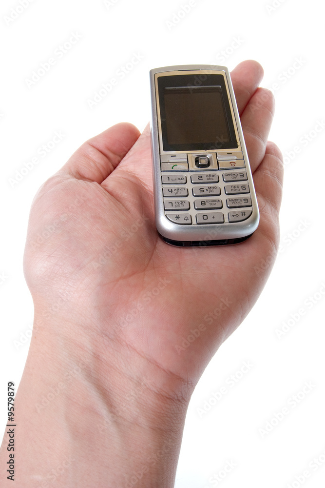 Small Silver Mobile Phone Device in hand Small Silver Mobile Phone Device in hand