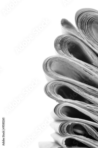 pile of news papers on white background