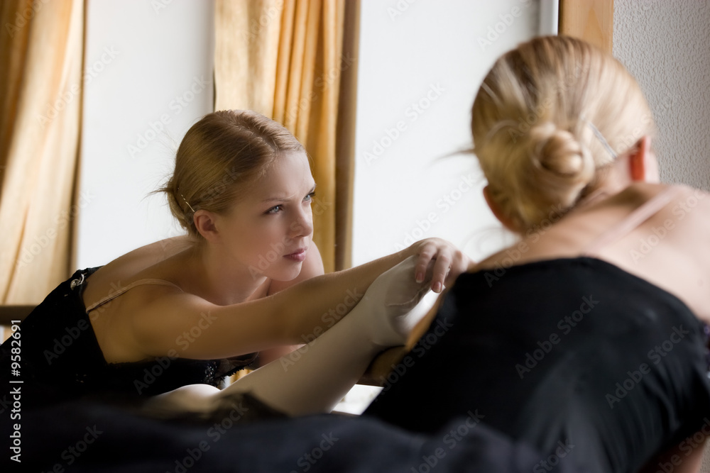 Fototapeta premium ballerina is doing exercises in ballet class