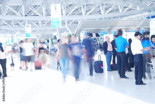 People in airport. Blurred. No recognizable faces or brandnames.