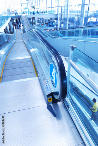 Travelator in airport. No recognizable faces or brandnames. photo